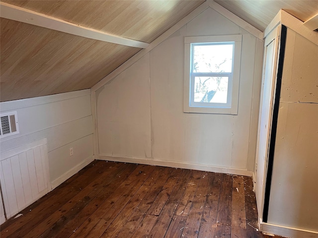 bonus room featuring lofted ceiling, radiator heating unit, and dark hardwood / wood-style floors