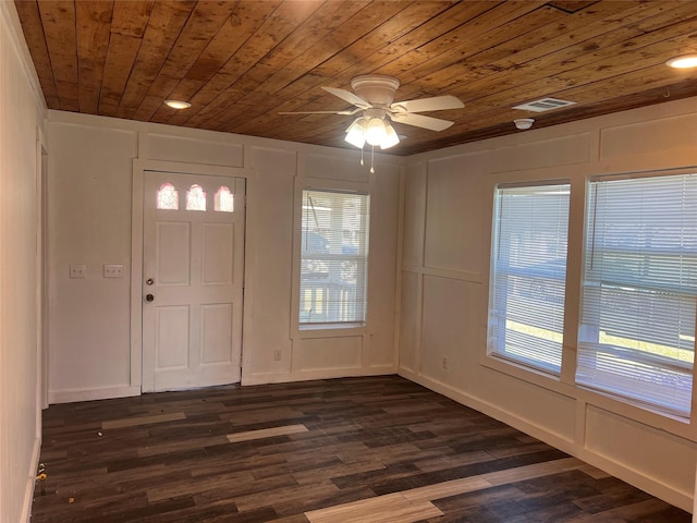 foyer featuring ceiling fan, wood ceiling, a healthy amount of sunlight, and dark hardwood / wood-style floors