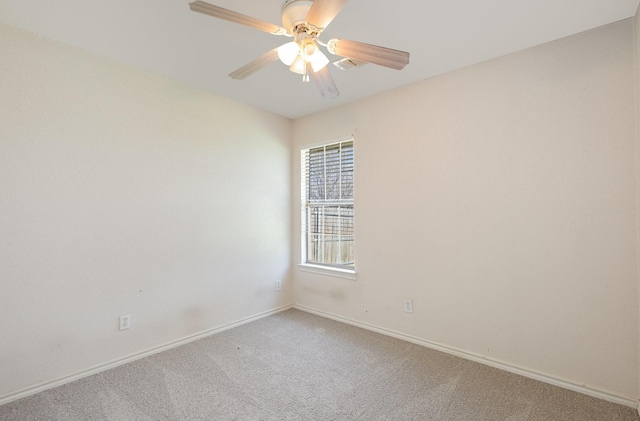 empty room featuring carpet flooring and ceiling fan