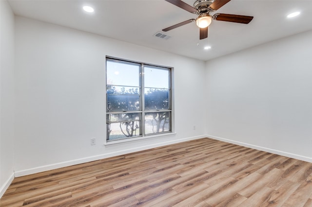 spare room with ceiling fan and light hardwood / wood-style flooring