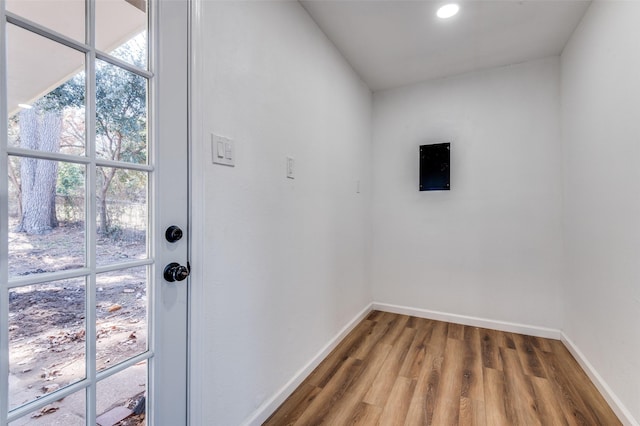 doorway with wood-type flooring