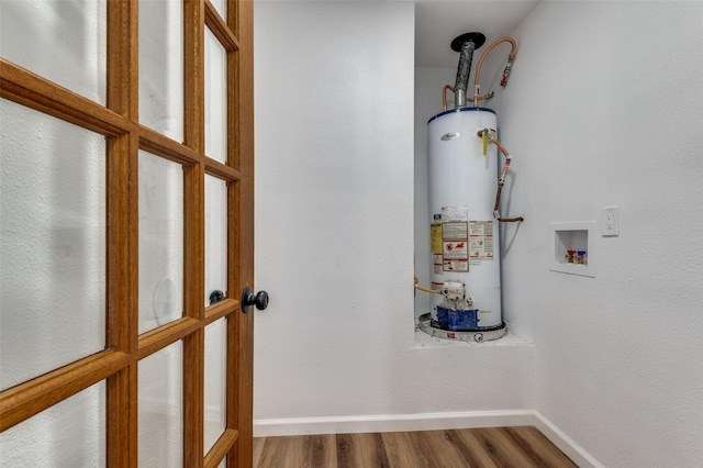 utility room featuring water heater