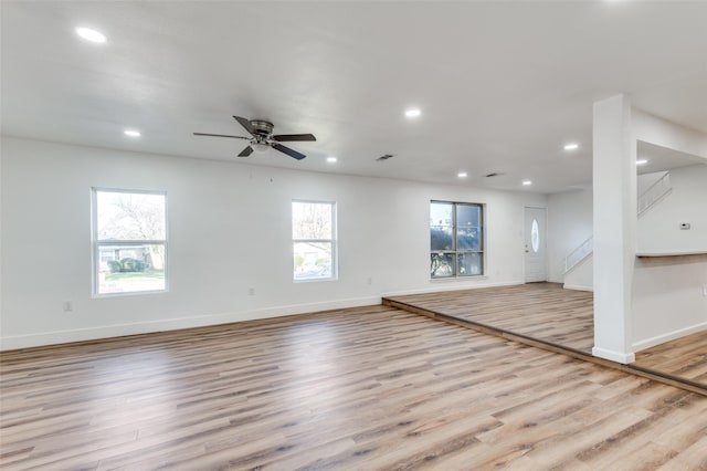 spare room with light hardwood / wood-style floors and ceiling fan