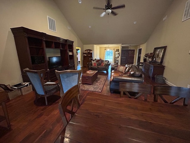 living room featuring lofted ceiling, dark hardwood / wood-style floors, and ceiling fan