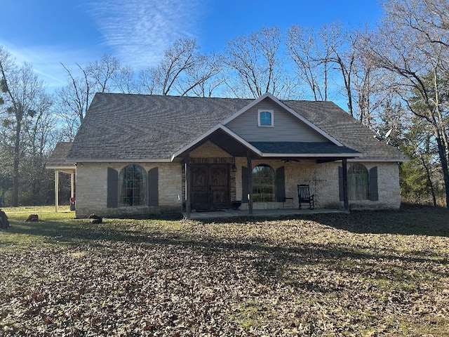 view of front of home featuring a front lawn and a porch