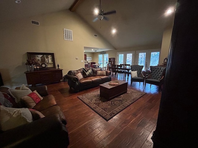 living room with dark wood-type flooring, ceiling fan, beam ceiling, and high vaulted ceiling