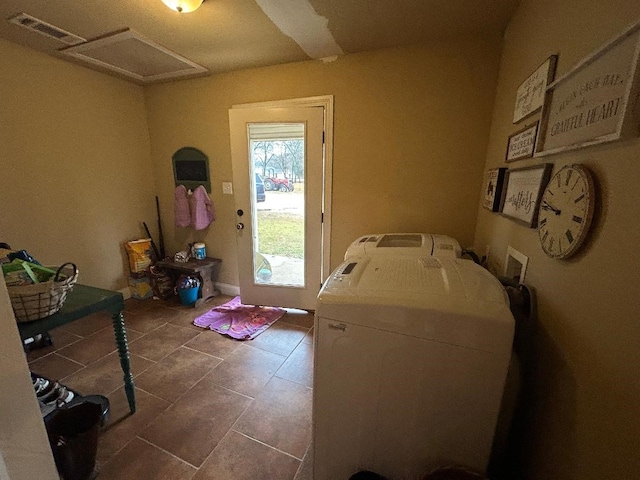 clothes washing area with washer and dryer