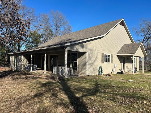 view of property exterior with a yard and a patio area