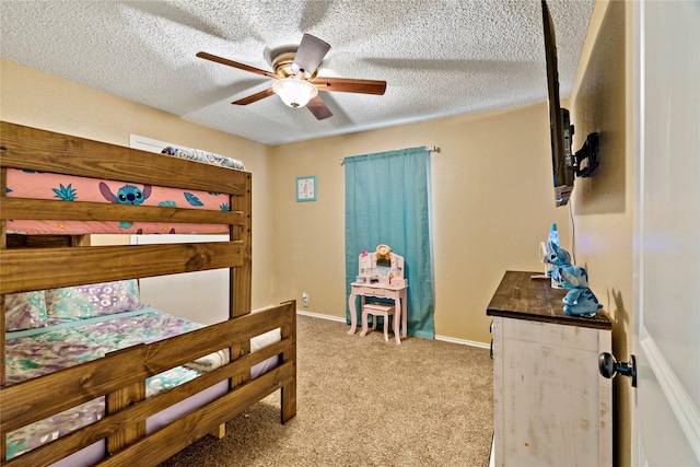 bedroom with a textured ceiling, light colored carpet, and ceiling fan