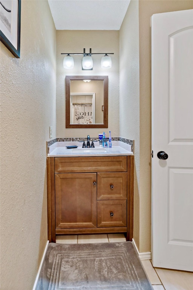 bathroom featuring tile patterned floors and vanity