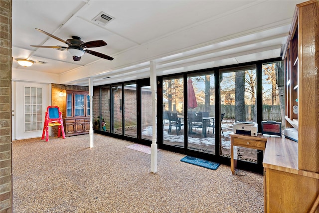 interior space with ceiling fan