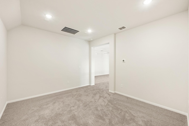 empty room featuring baseboards, carpet, visible vents, and recessed lighting