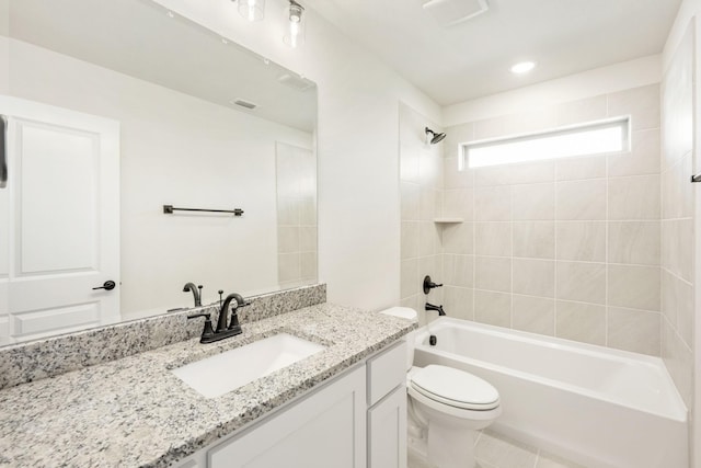 full bathroom with  shower combination, visible vents, vanity, and toilet