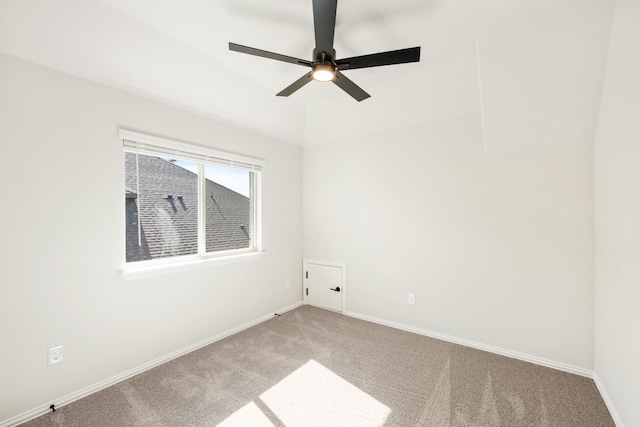 unfurnished room featuring a ceiling fan, light colored carpet, and baseboards