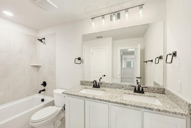 full bath featuring bathtub / shower combination, a sink, toilet, and double vanity