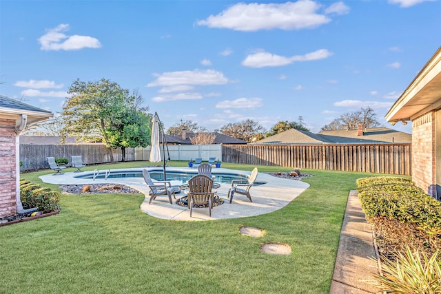 view of yard featuring a patio area and a fenced in pool