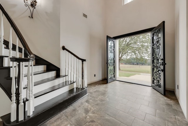 entryway with a high ceiling