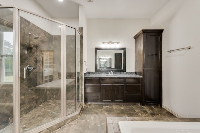 bathroom featuring vanity and plus walk in shower