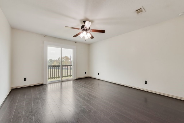 unfurnished room featuring ceiling fan and dark hardwood / wood-style flooring