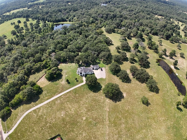 drone / aerial view featuring a water view and a rural view