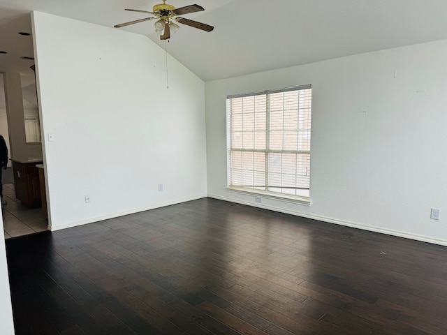 unfurnished room with ceiling fan, lofted ceiling, and dark wood-type flooring