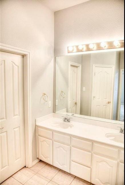 bathroom with vanity and tile patterned floors