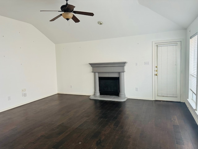 unfurnished living room with a fireplace, dark hardwood / wood-style flooring, ceiling fan, and lofted ceiling