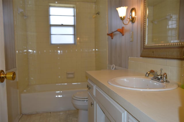 full bathroom with vanity, tile patterned floors, decorative backsplash, toilet, and tub / shower combination