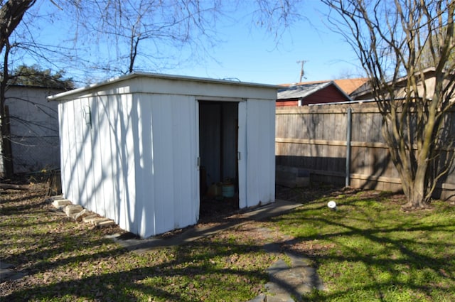 view of outdoor structure featuring a lawn