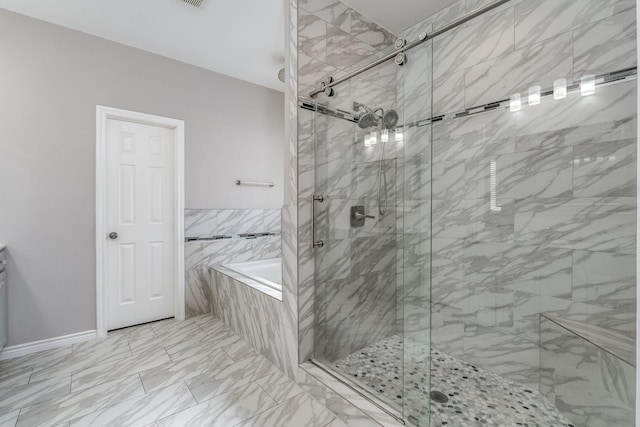 bathroom featuring separate shower and tub