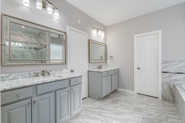 bathroom featuring a shower, vanity, and tile walls