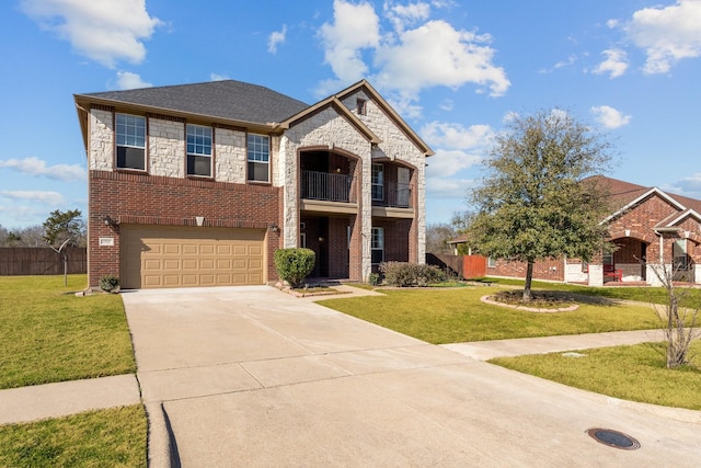 view of front of property featuring a front yard and a garage