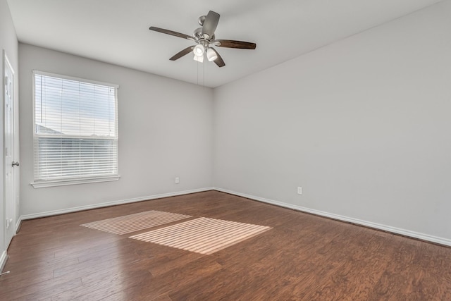 unfurnished room featuring dark hardwood / wood-style floors and ceiling fan