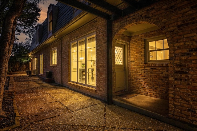 view of property exterior at dusk