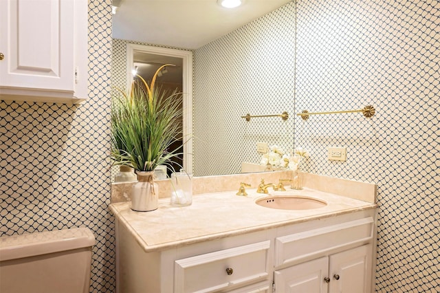 bathroom with vanity and toilet