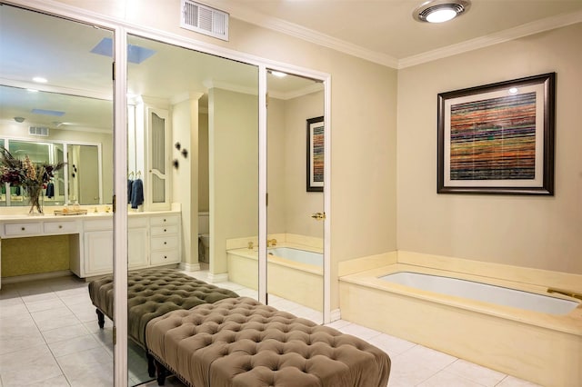 bathroom with toilet, crown molding, vanity, a tub, and tile patterned flooring