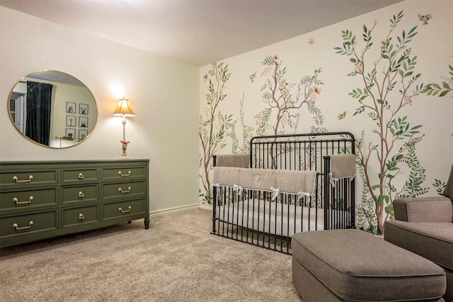 carpeted bedroom with a nursery area