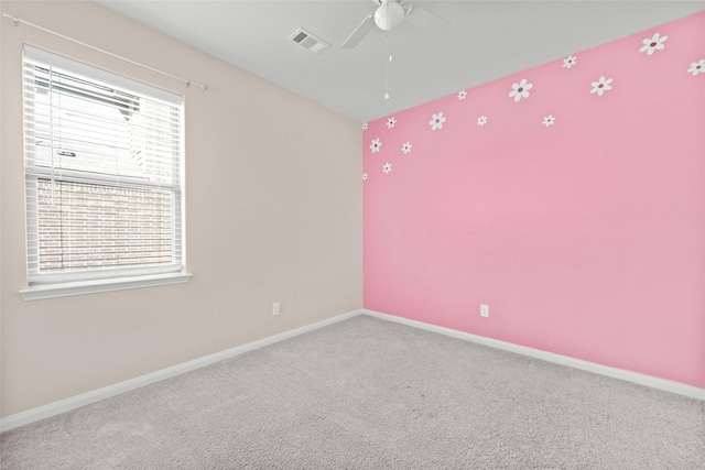 spare room featuring ceiling fan and carpet floors