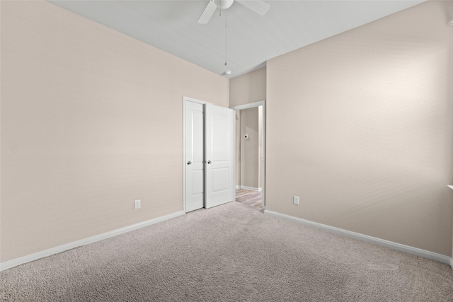 empty room featuring carpet and ceiling fan