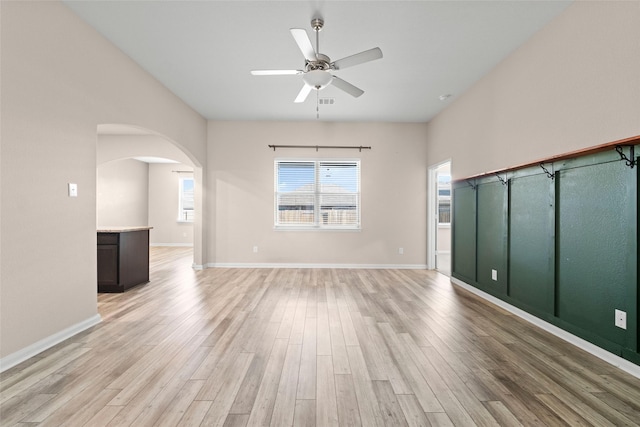 spare room featuring ceiling fan and light wood-type flooring