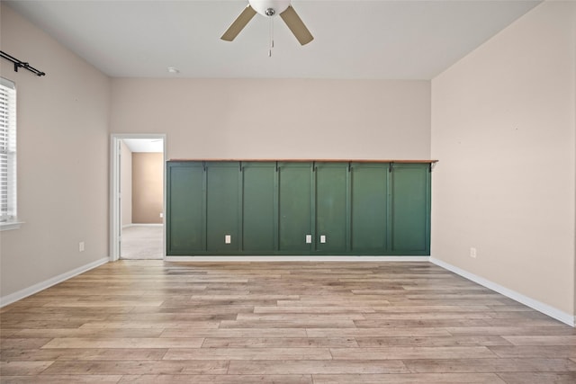 unfurnished room with light hardwood / wood-style flooring and ceiling fan