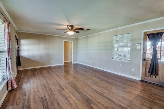 spare room with dark hardwood / wood-style flooring, ceiling fan, and crown molding