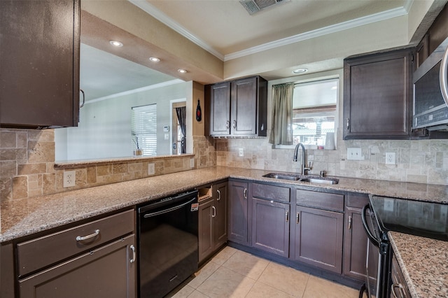 kitchen with backsplash, black appliances, sink, light tile patterned floors, and dark brown cabinets