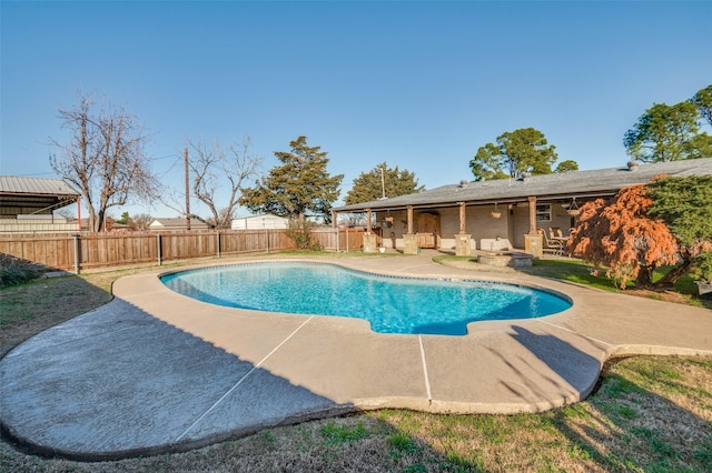 view of swimming pool with a patio