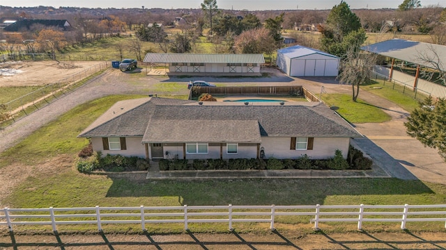 birds eye view of property with a rural view