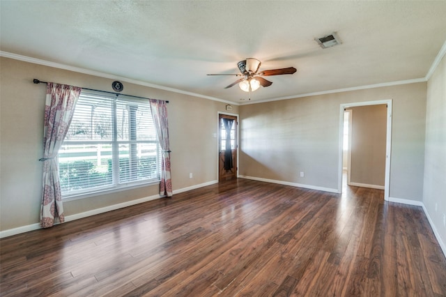 empty room featuring dark hardwood / wood-style flooring, ceiling fan, and crown molding