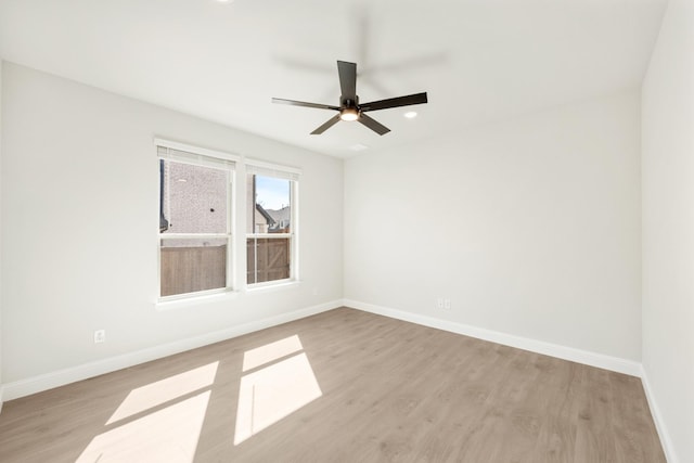 unfurnished room with ceiling fan, recessed lighting, light wood-style flooring, and baseboards