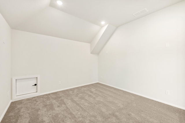 additional living space featuring lofted ceiling, recessed lighting, visible vents, carpet flooring, and baseboards