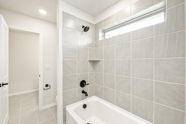 full bath featuring tile patterned floors, baseboards, toilet, and shower / bathtub combination