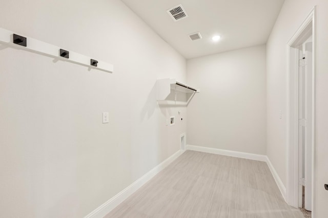 laundry area featuring laundry area, baseboards, hookup for a washing machine, and visible vents